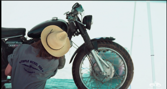 Stacie B. London working on motorcycle