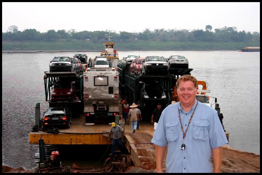 global expedition vehicle on a barge in south america