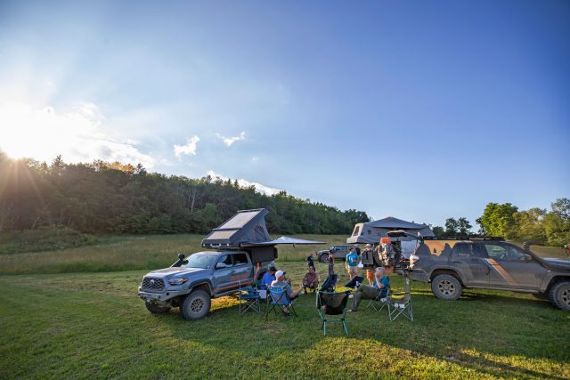 Friends camping with outfitted rigs